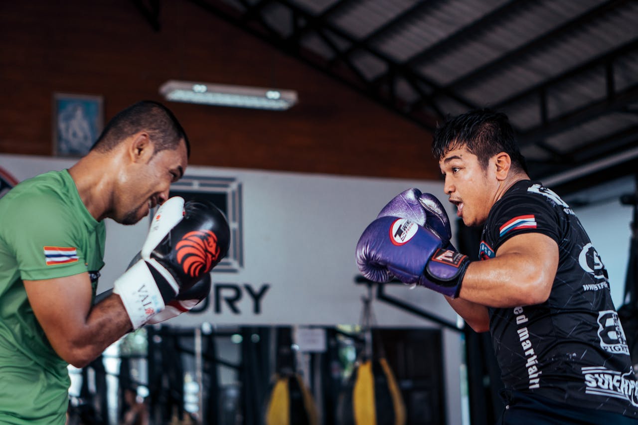 Men Wearing Boxing Gloves