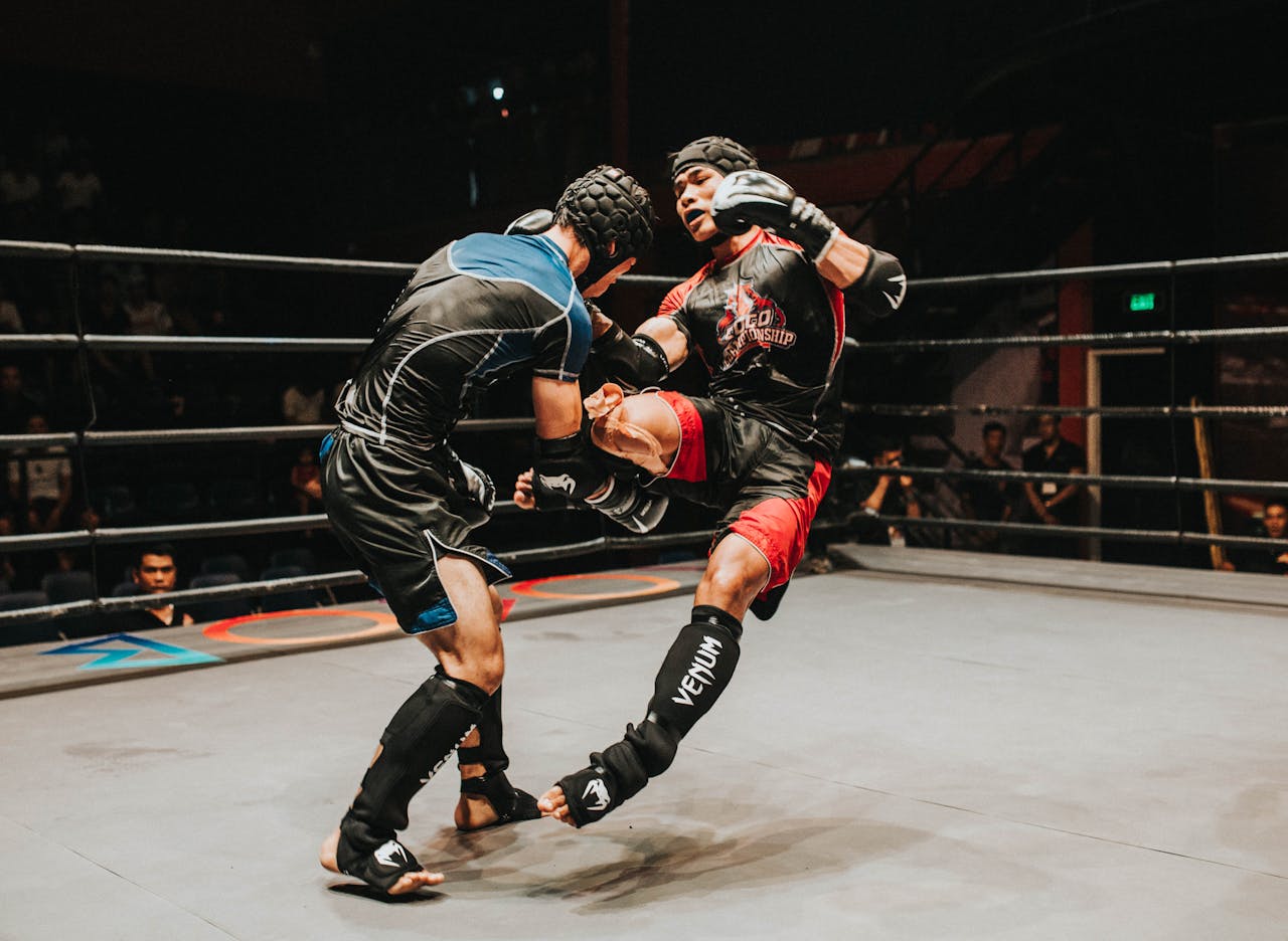 Two Fighter Fighting Inside Ring